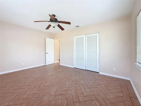 a view of an empty room with a window