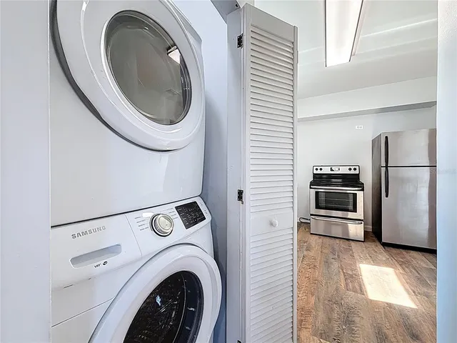 a view of a hallway with washer and dryer