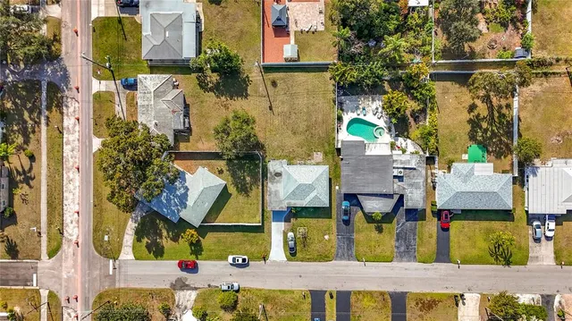 a backyard of a house with plants and outdoor seating