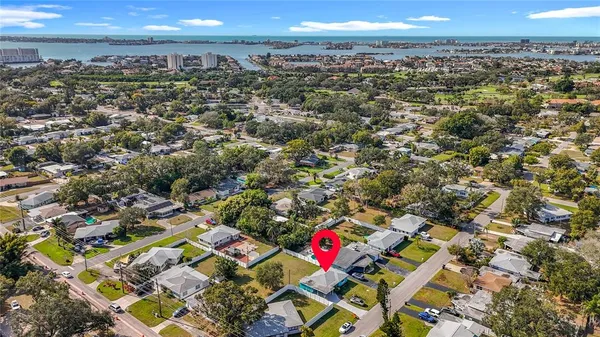 an aerial view of a house with swimming pool outdoor seating
