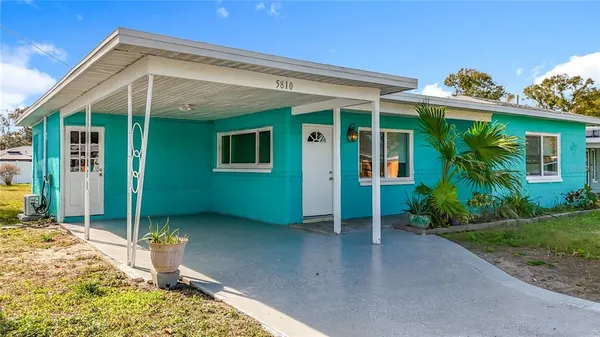 an aerial view of residential building and ocean