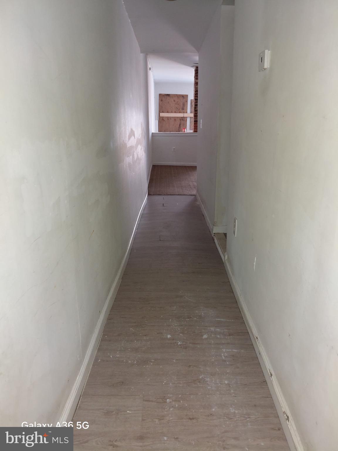 2328 Nicholson Street Southeast Washington, DC 20020 - Photo 13 of 26 a view of a hallway with wooden floor