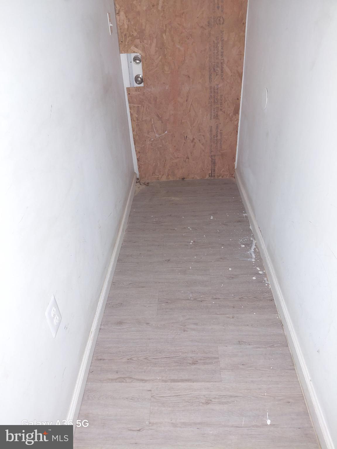 2328 Nicholson Street Southeast Washington, DC 20020 - Photo 15 of 26 a view of a hallway with wooden floor