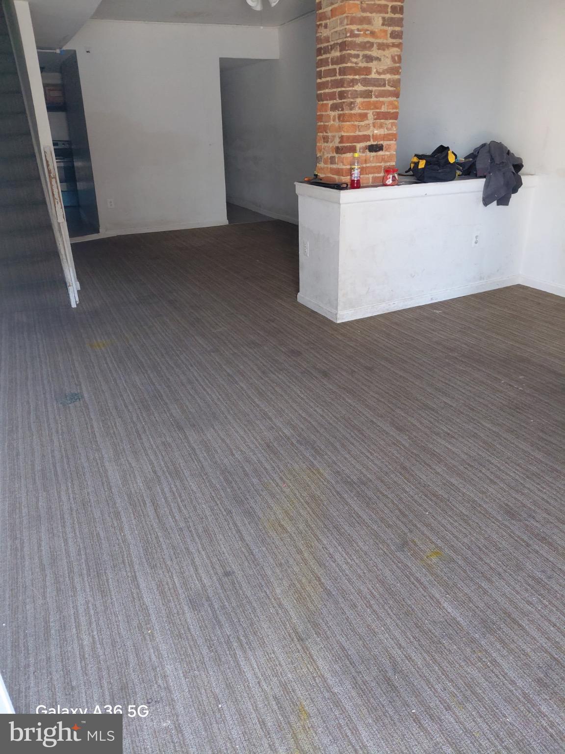 2328 Nicholson Street Southeast Washington, DC 20020 - Photo 19 of 26 a view of an empty room with wooden floor and a window