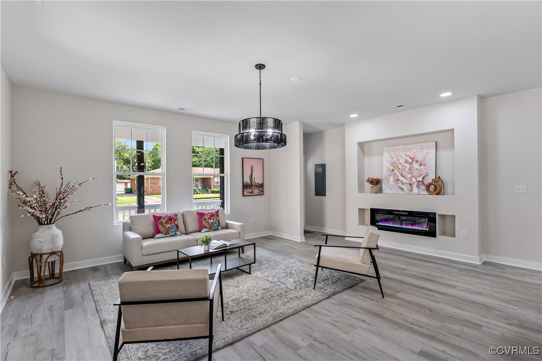 1125 Rome Street Petersburg, VA 23803 - Photo 12 of 38 Living room featuring a notable chandelier and lig