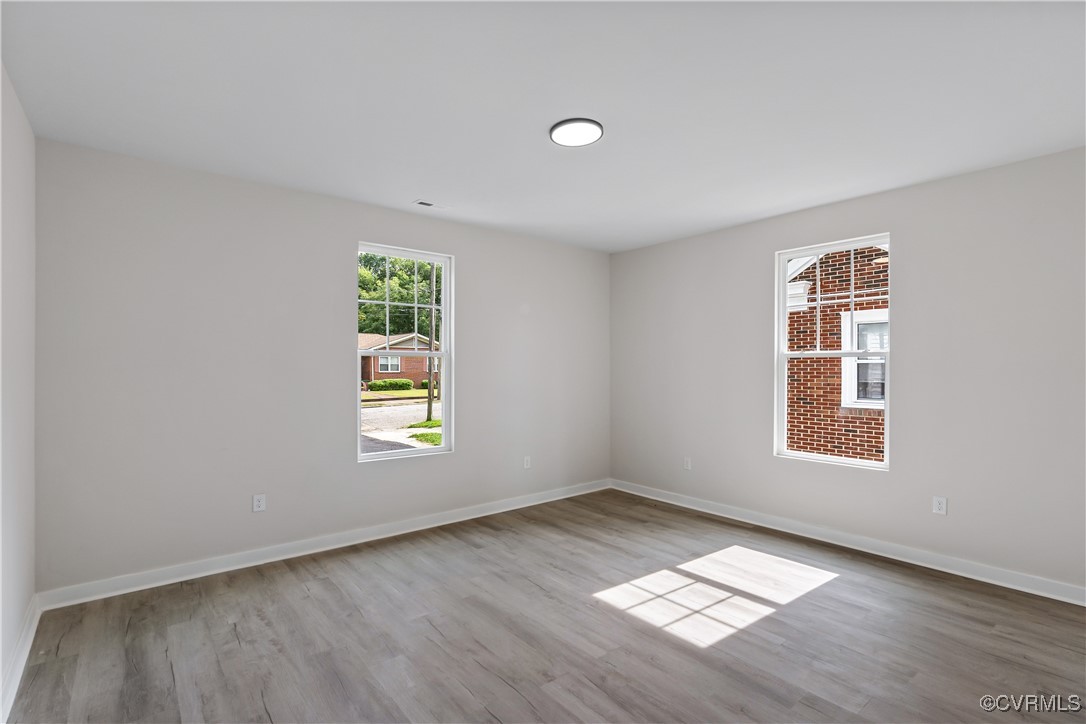 1125 Rome Street Petersburg, VA 23803 - Photo 24 of 38 Empty room featuring wood-type flooring