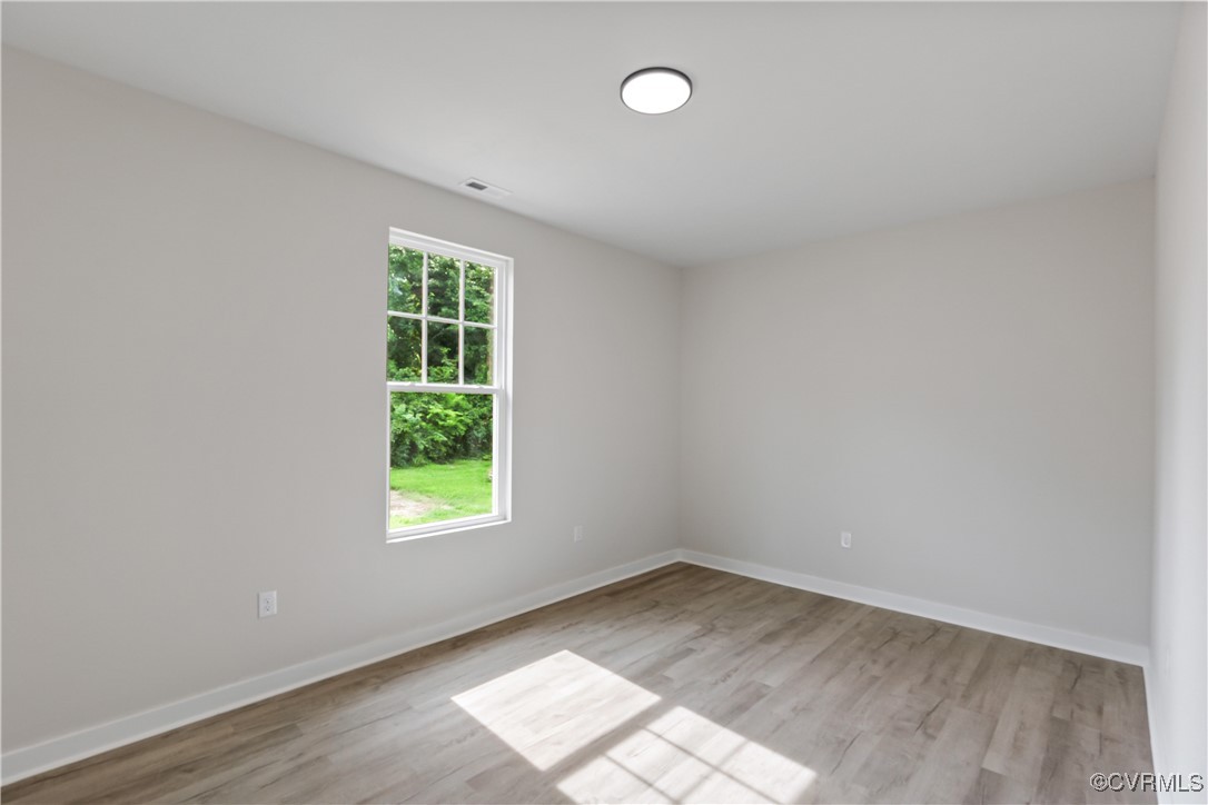 1125 Rome Street Petersburg, VA 23803 - Photo 27 of 38 Spare room with light hardwood / wood-style floori