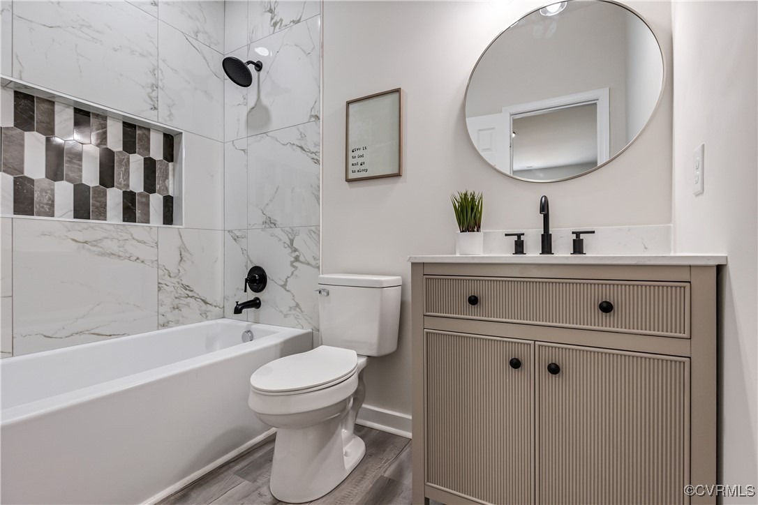 1125 Rome Street Petersburg, VA 23803 - Photo 30 of 38 Full bathroom featuring toilet, hardwood / wood-st