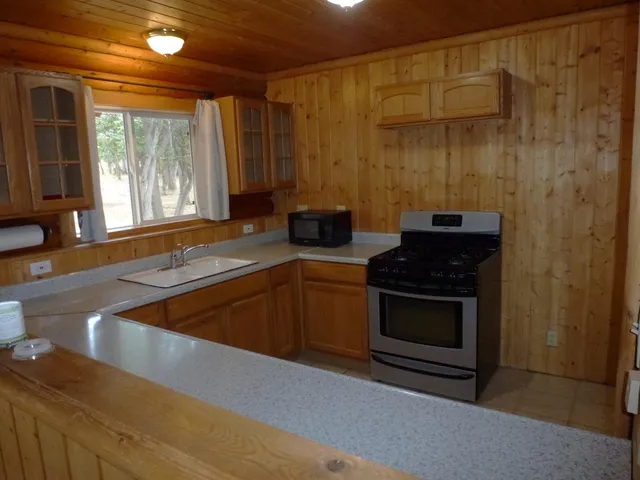 a kitchen with a stove and a sink