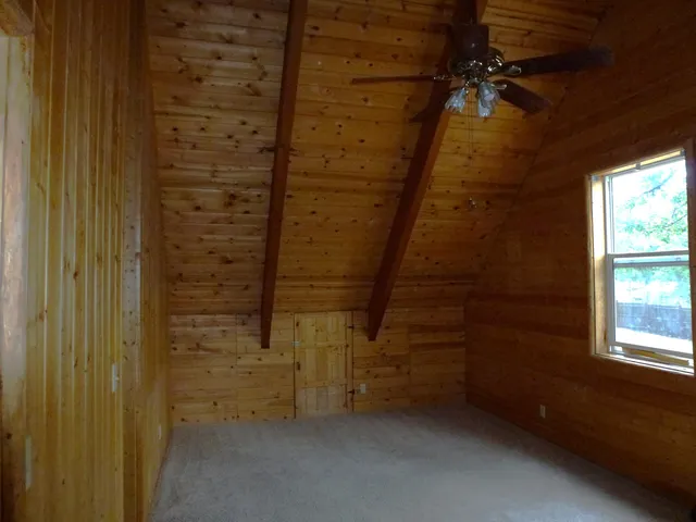 a view of empty room with windows
