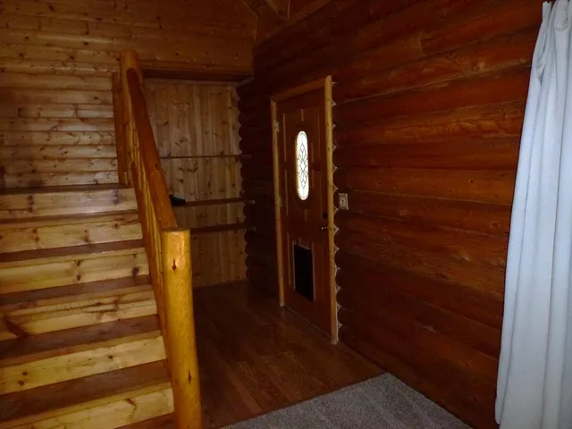 a view of entryway with wooden floor