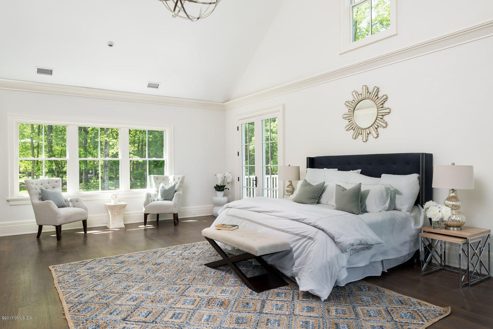 49 Byfield Lane Greenwich, CT 06830 - Photo 11 of 14 a bedroom with a bed and wooden floor