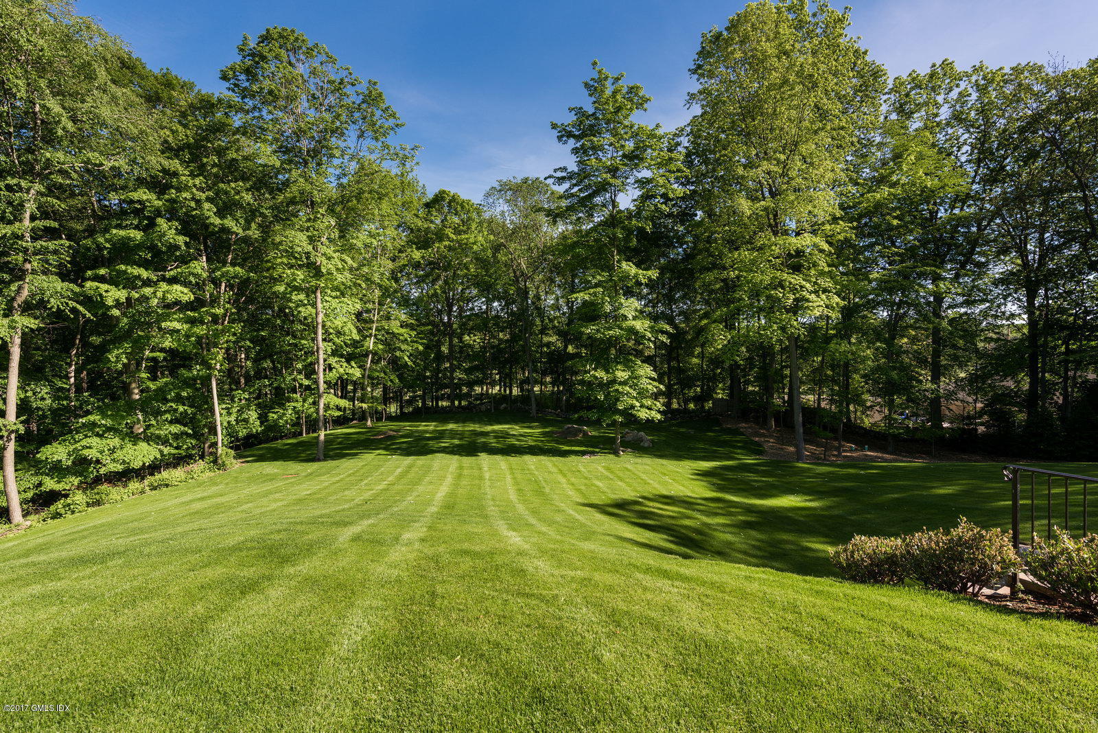 49 Byfield Lane Greenwich, CT 06830 - Photo 13 of 14 a view of a golf course with a park