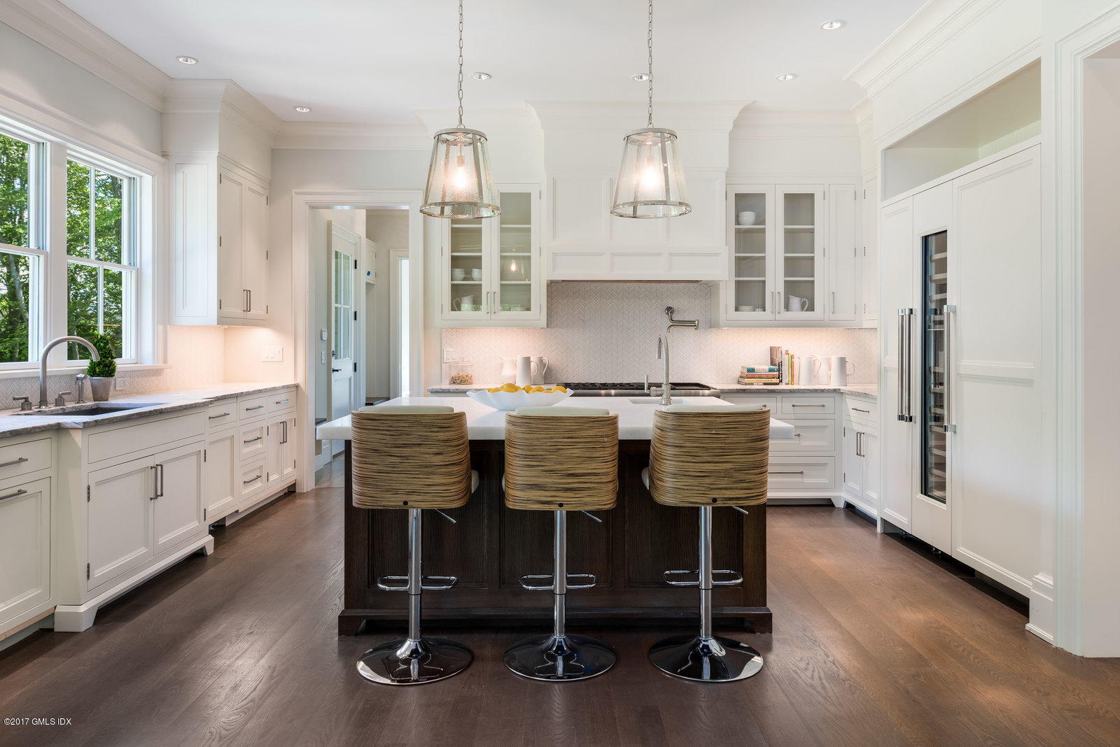 49 Byfield Lane Greenwich, CT 06830 - Photo 6 of 14 a kitchen with granite countertop white cabinets stainless steel appliances and sink