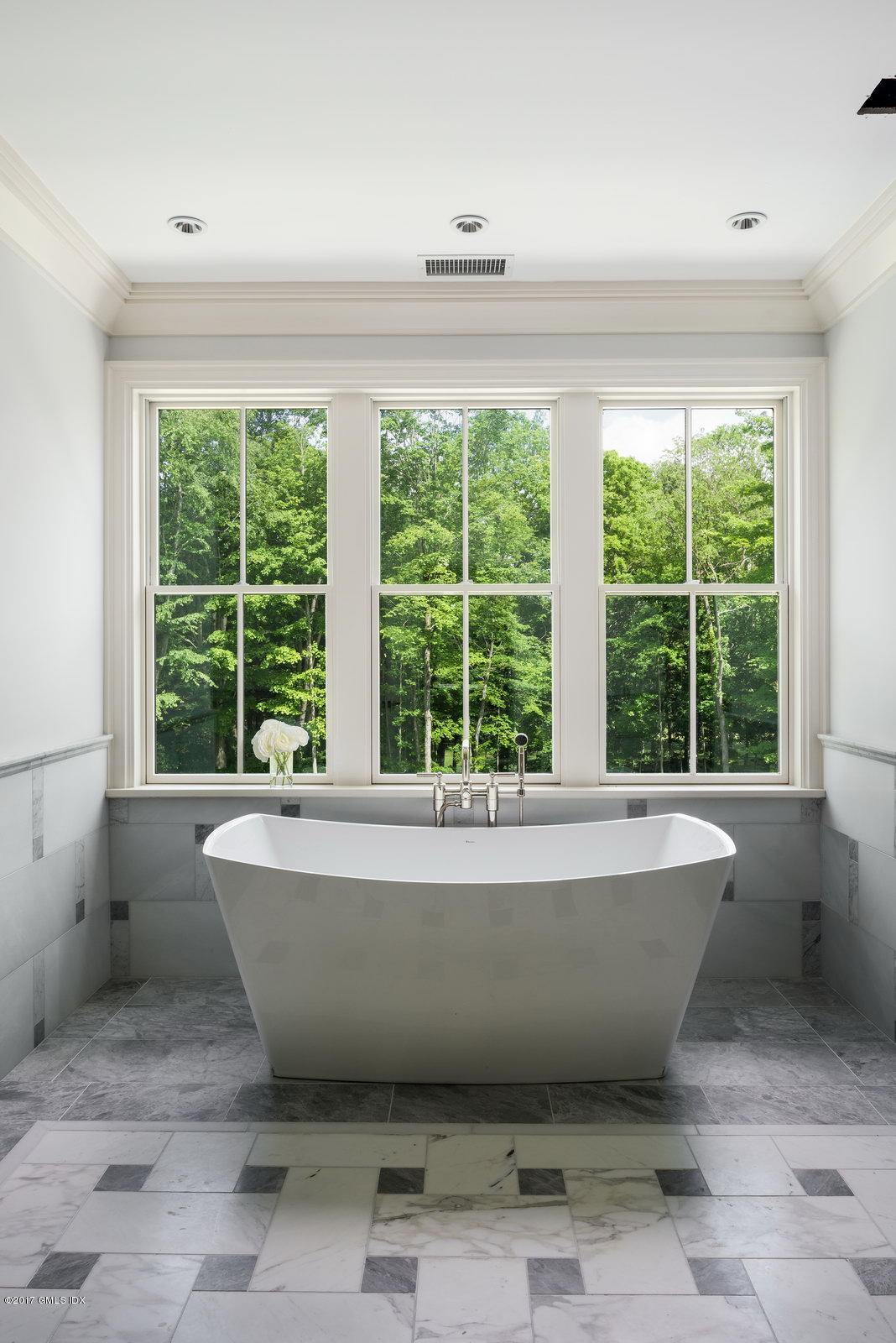 49 Byfield Lane Greenwich, CT 06830 - Photo 9 of 14 a bath tub sitting in a room next to a window