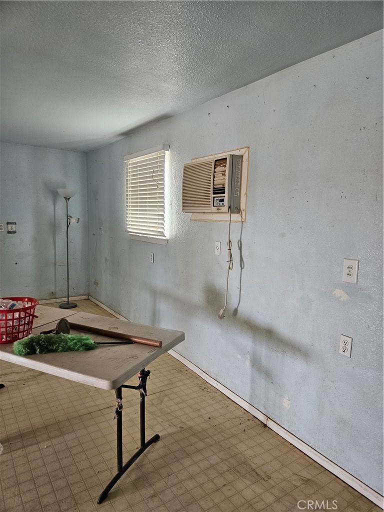 11175 Tyee Road Apple Valley, CA 92308 - Photo 20 of 31 a living room with furniture and a table