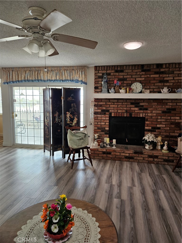 11175 Tyee Road Apple Valley, CA 92308 - Photo 2 of 31 a living room with furniture and a fireplace