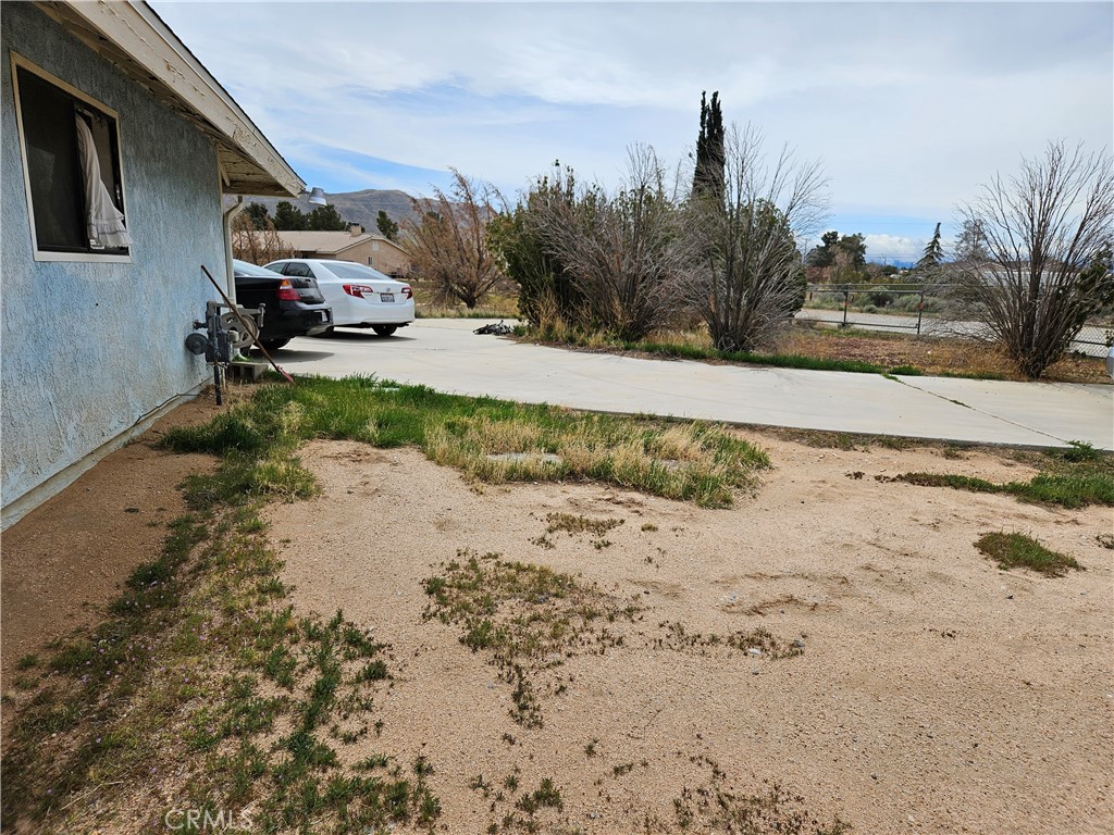 11175 Tyee Road Apple Valley, CA 92308 - Photo 28 of 31 a view of a yard with a snow on the road