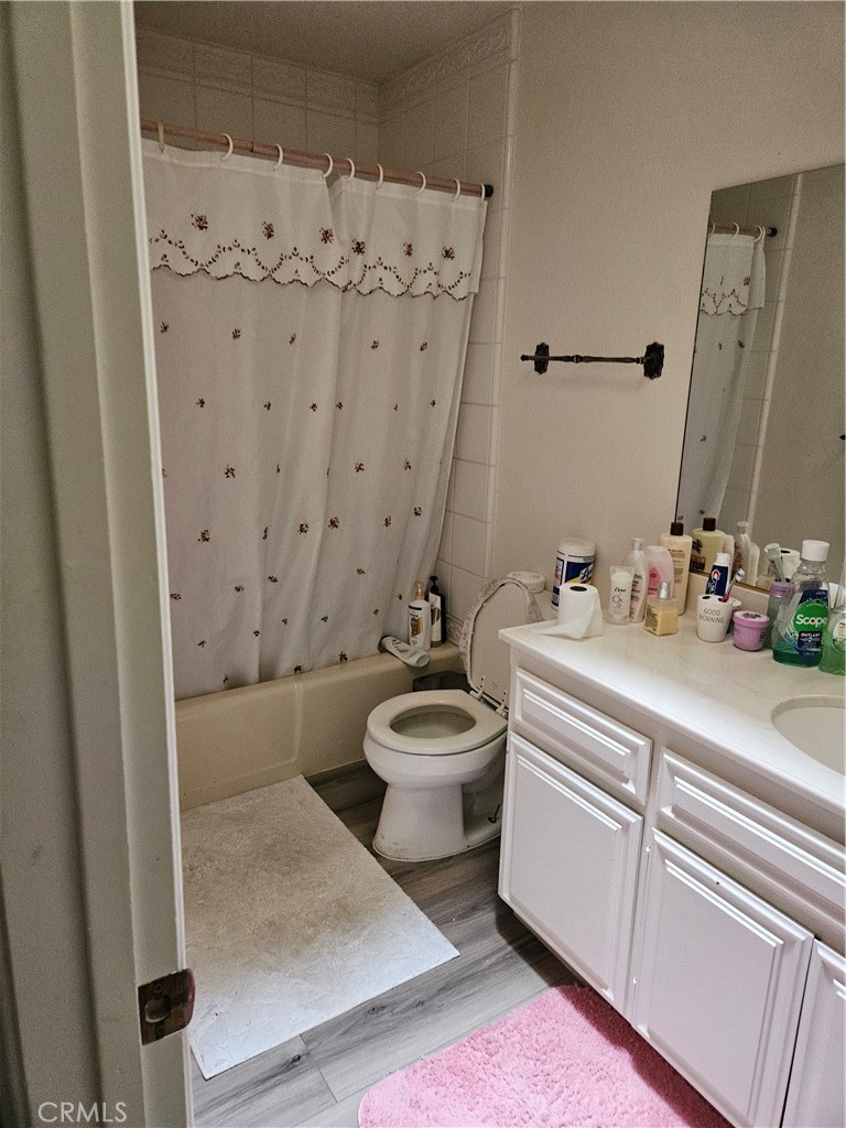 11175 Tyee Road Apple Valley, CA 92308 - Photo 5 of 31 a bathroom with a sink a toilet and shower