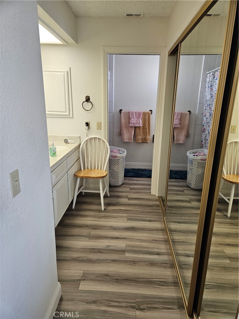 11175 Tyee Road Apple Valley, CA 92308 - Photo 7 of 31 a living room with furniture and a wooden floor