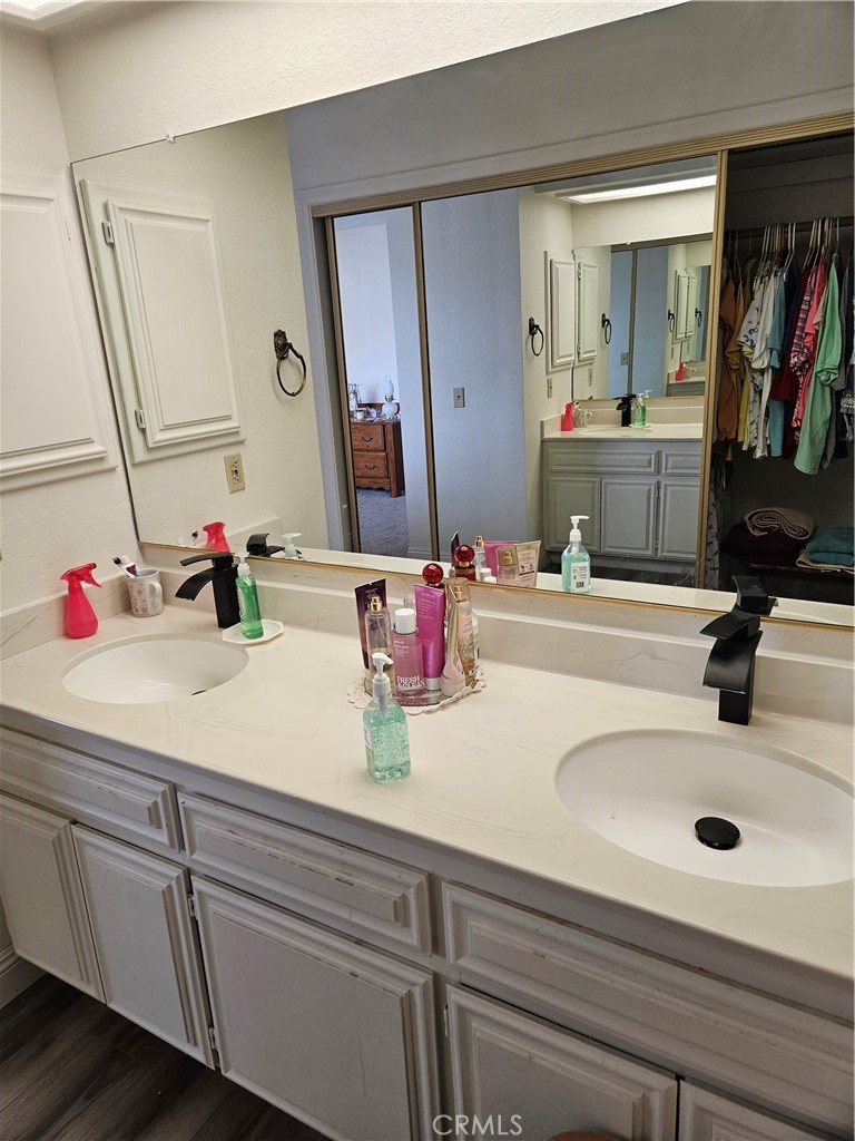11175 Tyee Road Apple Valley, CA 92308 - Photo 8 of 31 a bathroom with a sink and a mirror
