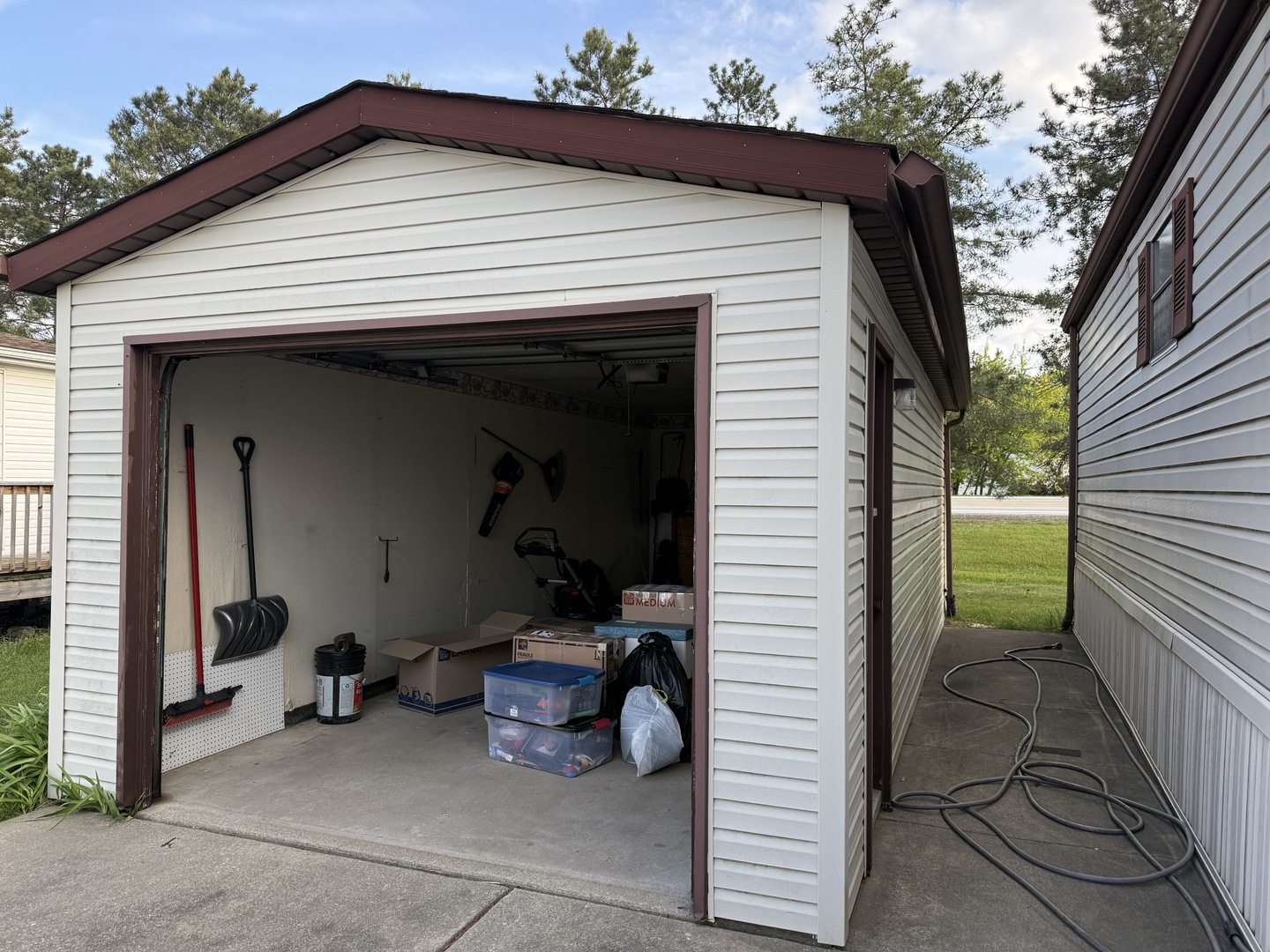 17 Cardinal Drive Beecher, IL 60401 - Photo 4 of 17 a view of a patio with table and chairs and a barbeque