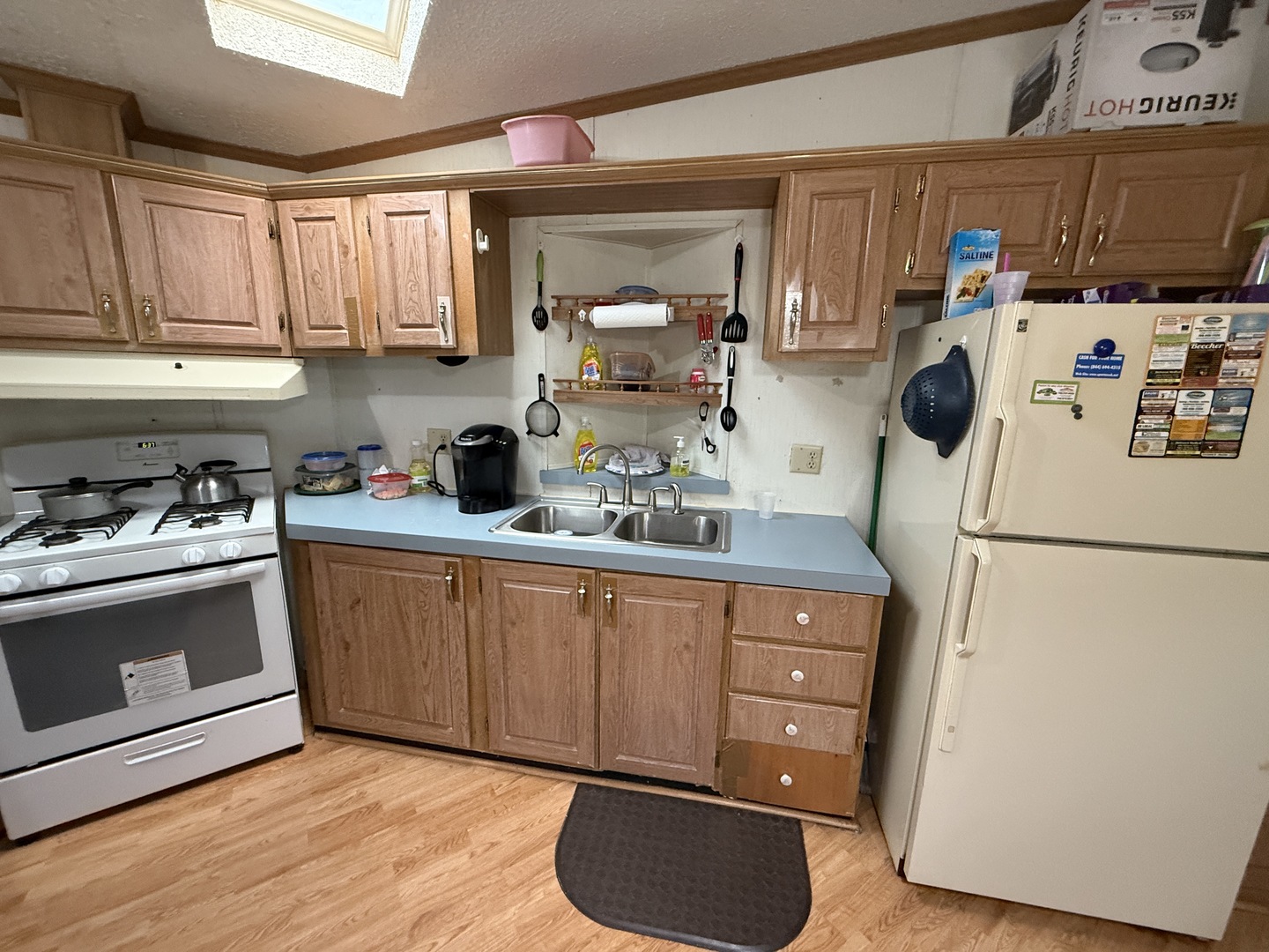 17 Cardinal Drive Beecher, IL 60401 - Photo 8 of 17 a kitchen with a refrigerator sink and white cabinets