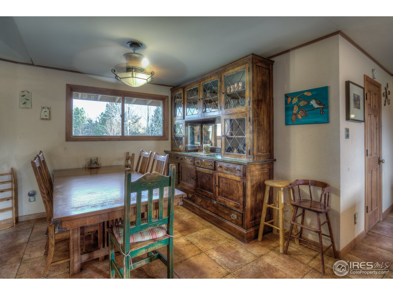 1950 Riverside Avenue Boulder, CO 80304 - Photo 11 of 21 a view of a dining room with furniture and chandelier
