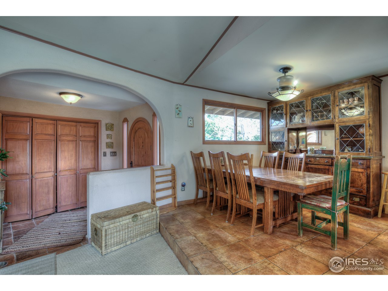 1950 Riverside Avenue Boulder, CO 80304 - Photo 12 of 21 a dining room with furniture a rug and a large window