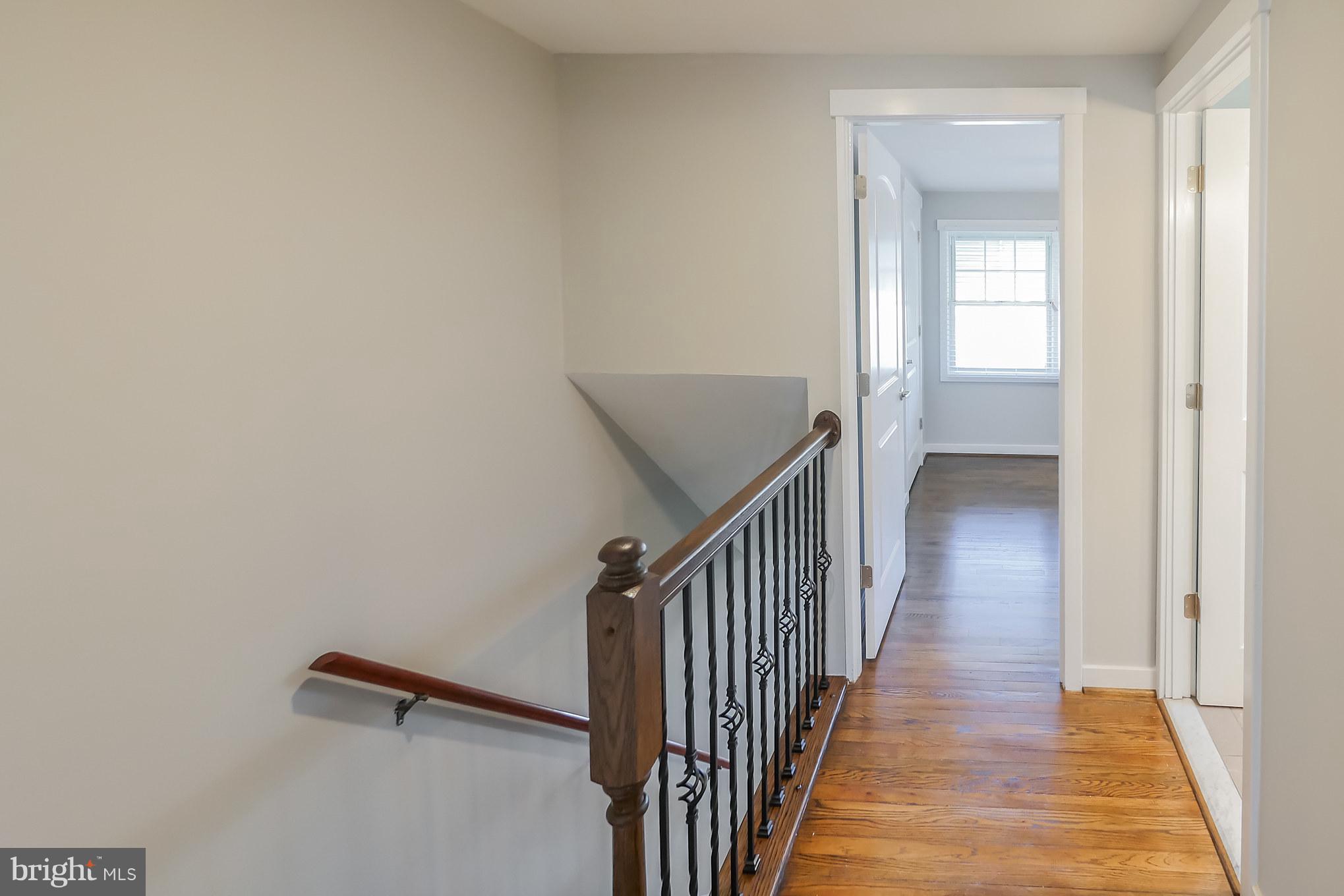 4410 Annapolis Road Baltimore, MD 21227 - Photo 27 of 31 a view of a hallway with wooden floor