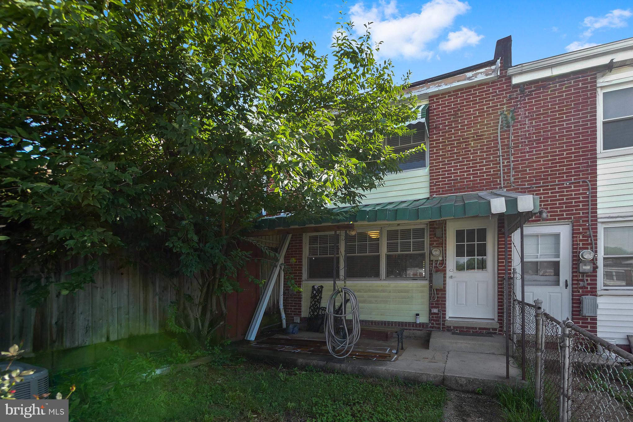 4410 Annapolis Road Baltimore, MD 21227 - Photo 28 of 31 a view of backyard with table and chairs and potted plants