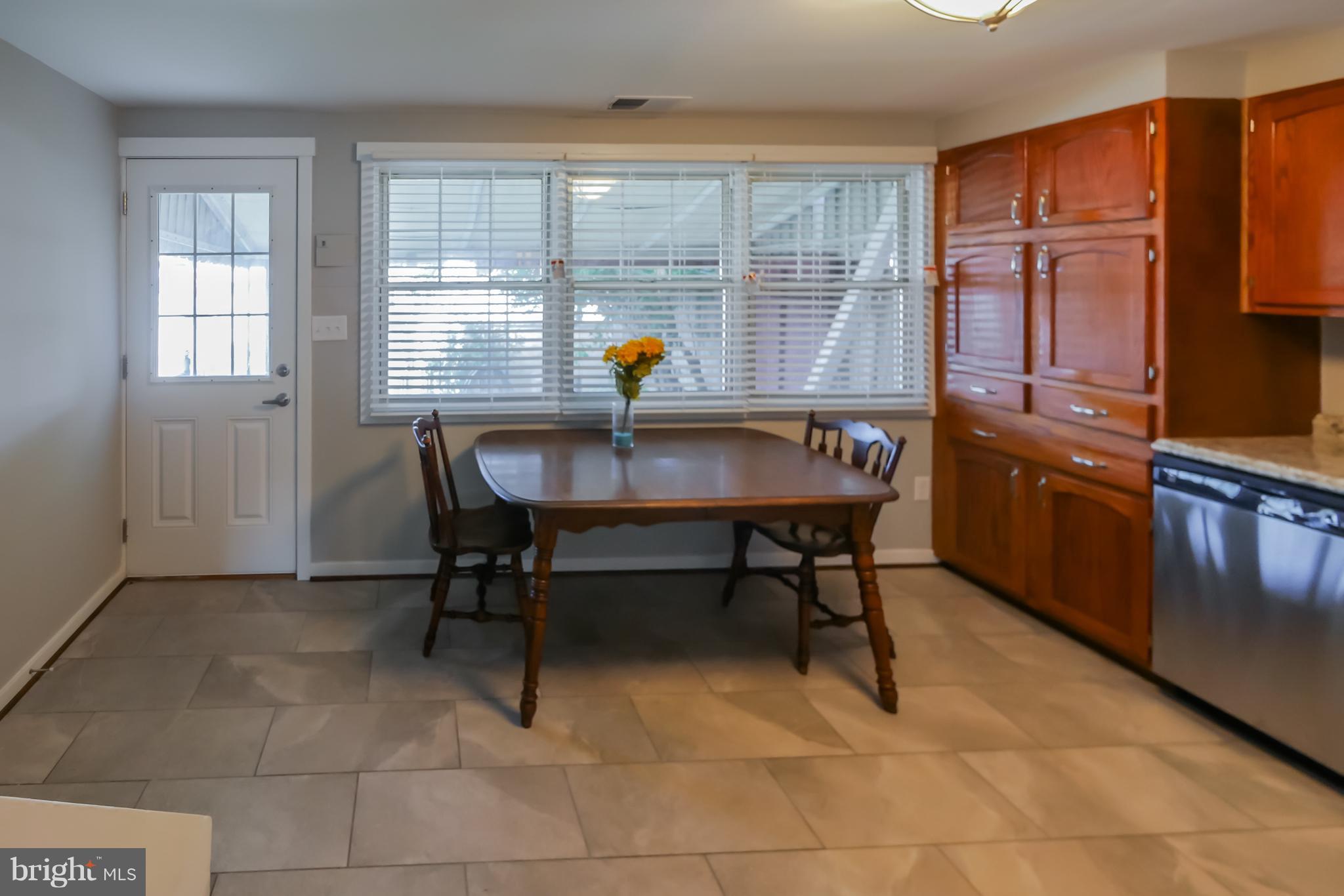 4410 Annapolis Road Baltimore, MD 21227 - Photo 7 of 31 a view of a workspace with furniture and window