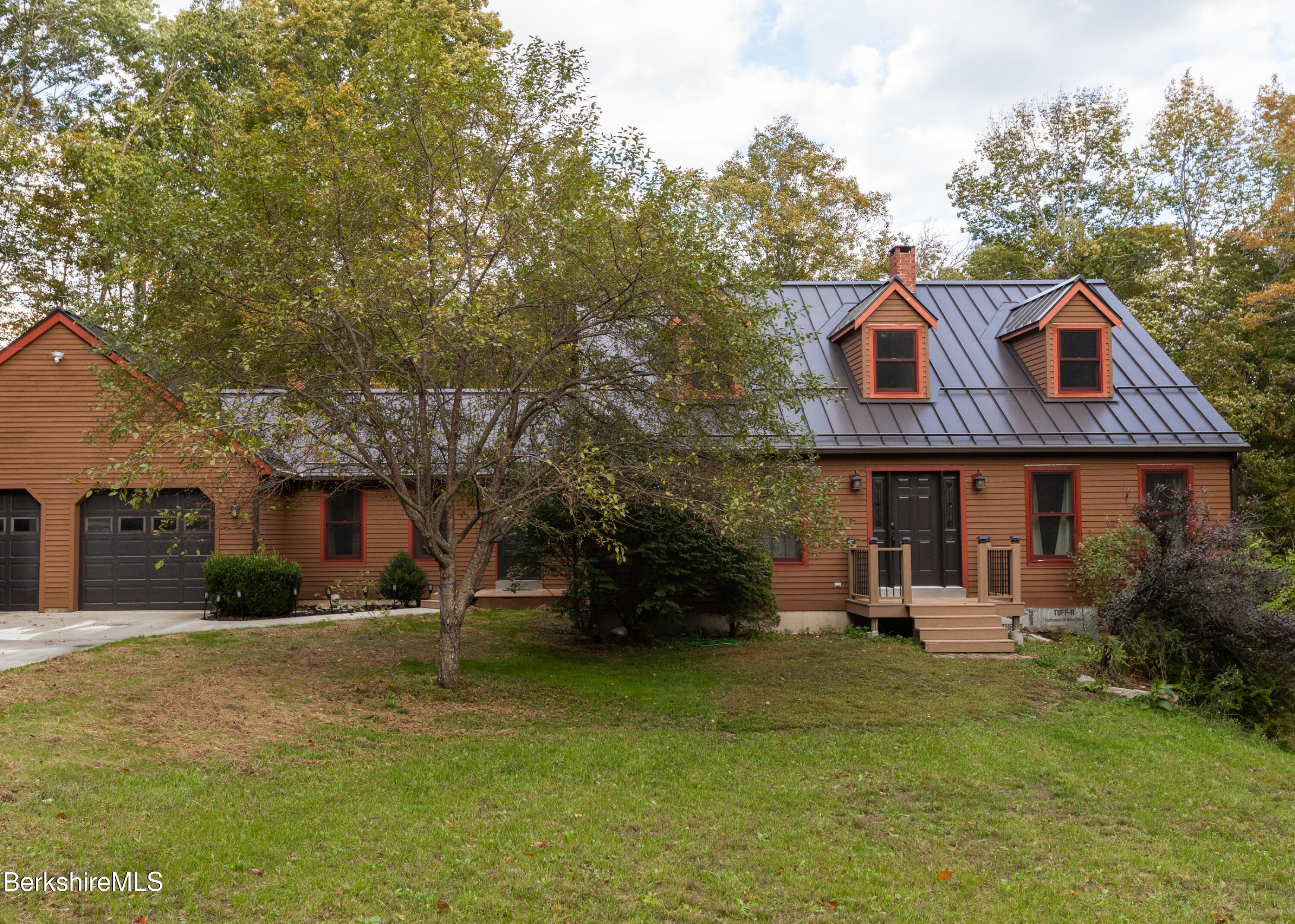 1191 South Washington State Road Washington, MA 01223 - Photo 1 of 41 a front view of a house with garden