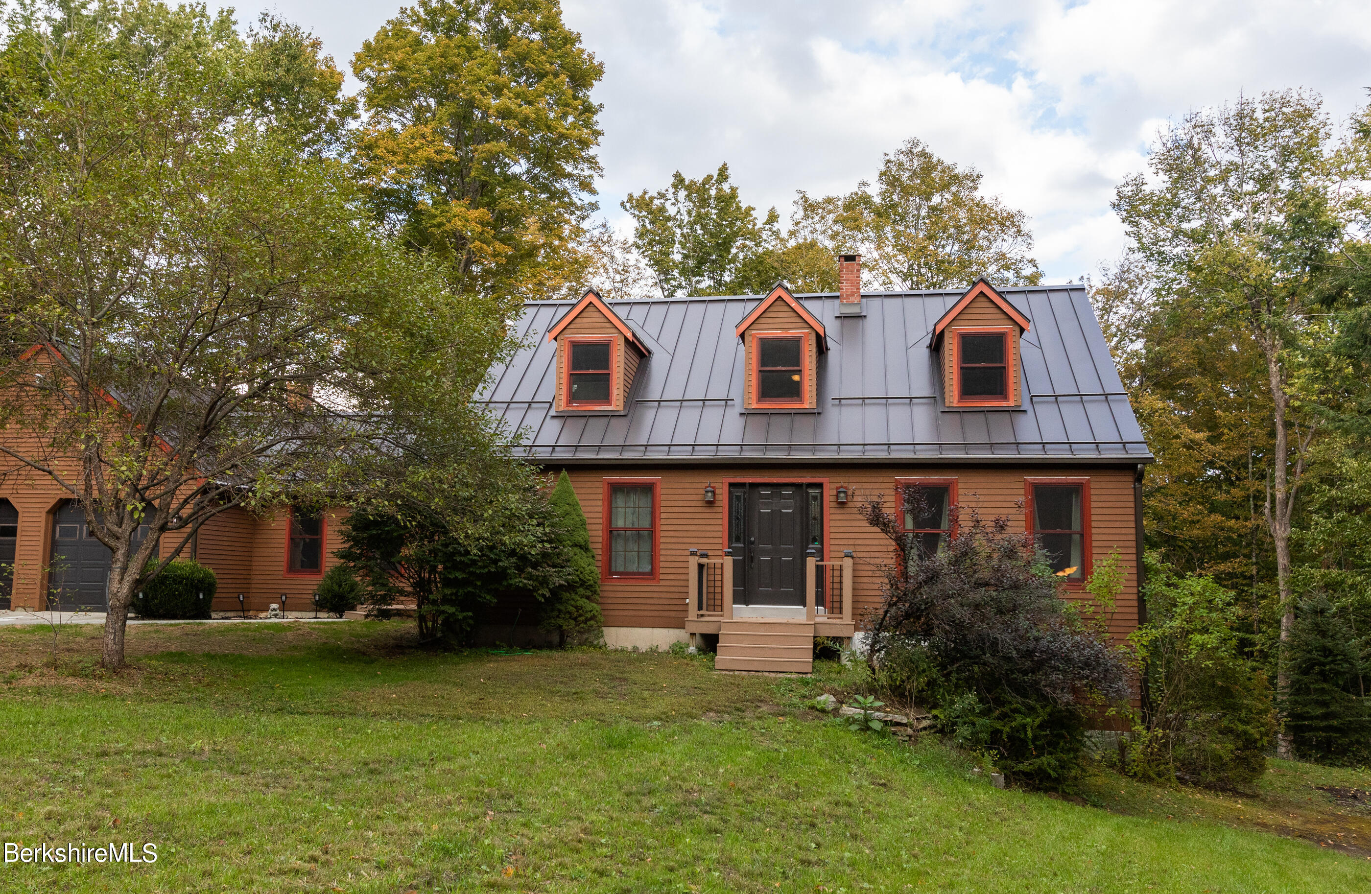 1191 South Washington State Road Washington, MA 01223 - Photo 2 of 41 a front view of a house with a garden