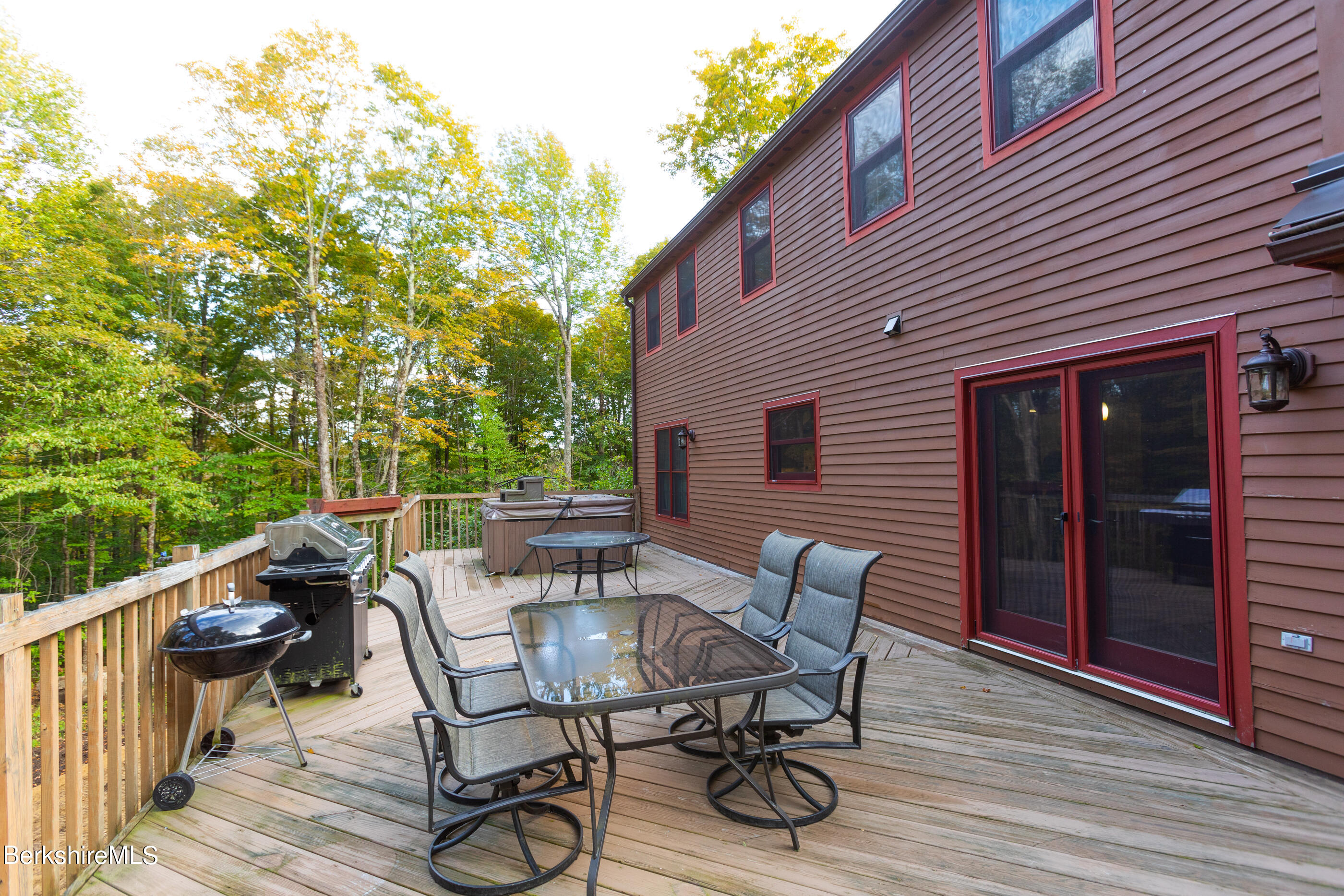 1191 South Washington State Road Washington, MA 01223 - Photo 41 of 41 a view of a patio with table and chairs with wooden floor and fence