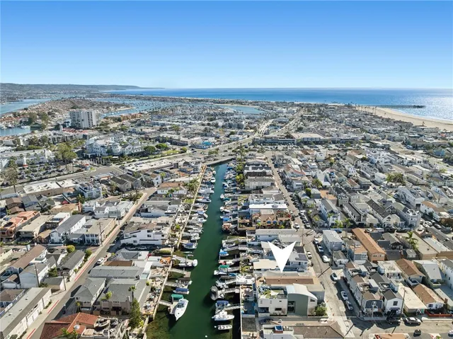 an aerial view of a city with ocean view
