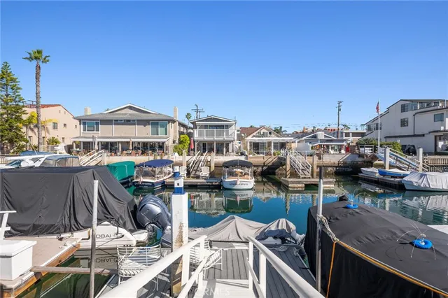 a view of a chairs and table in a balcony