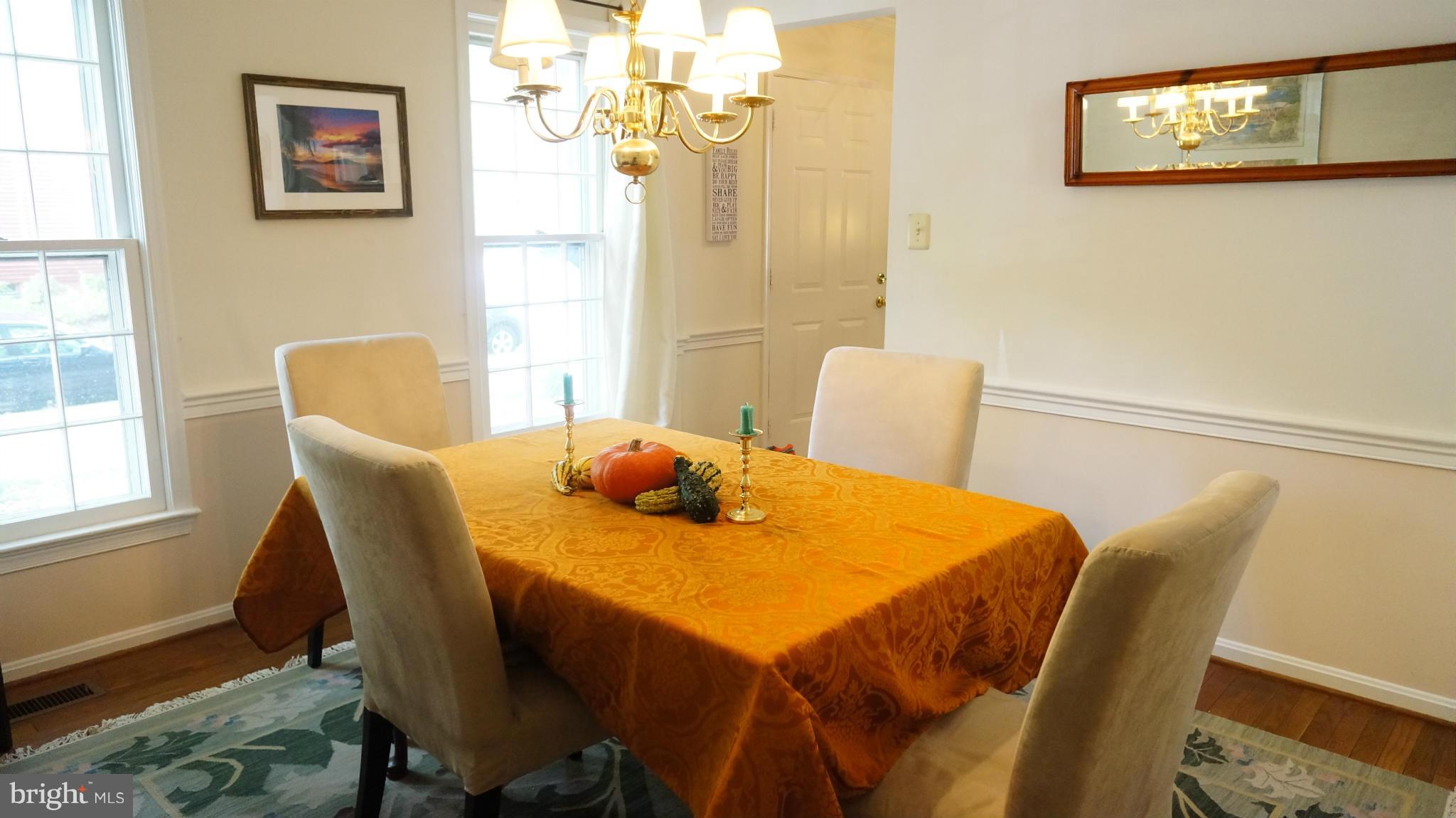 2117 Salt Kettle Way Reston, VA 20191 - Photo 13 of 30 a view of a dining room with furniture and a window