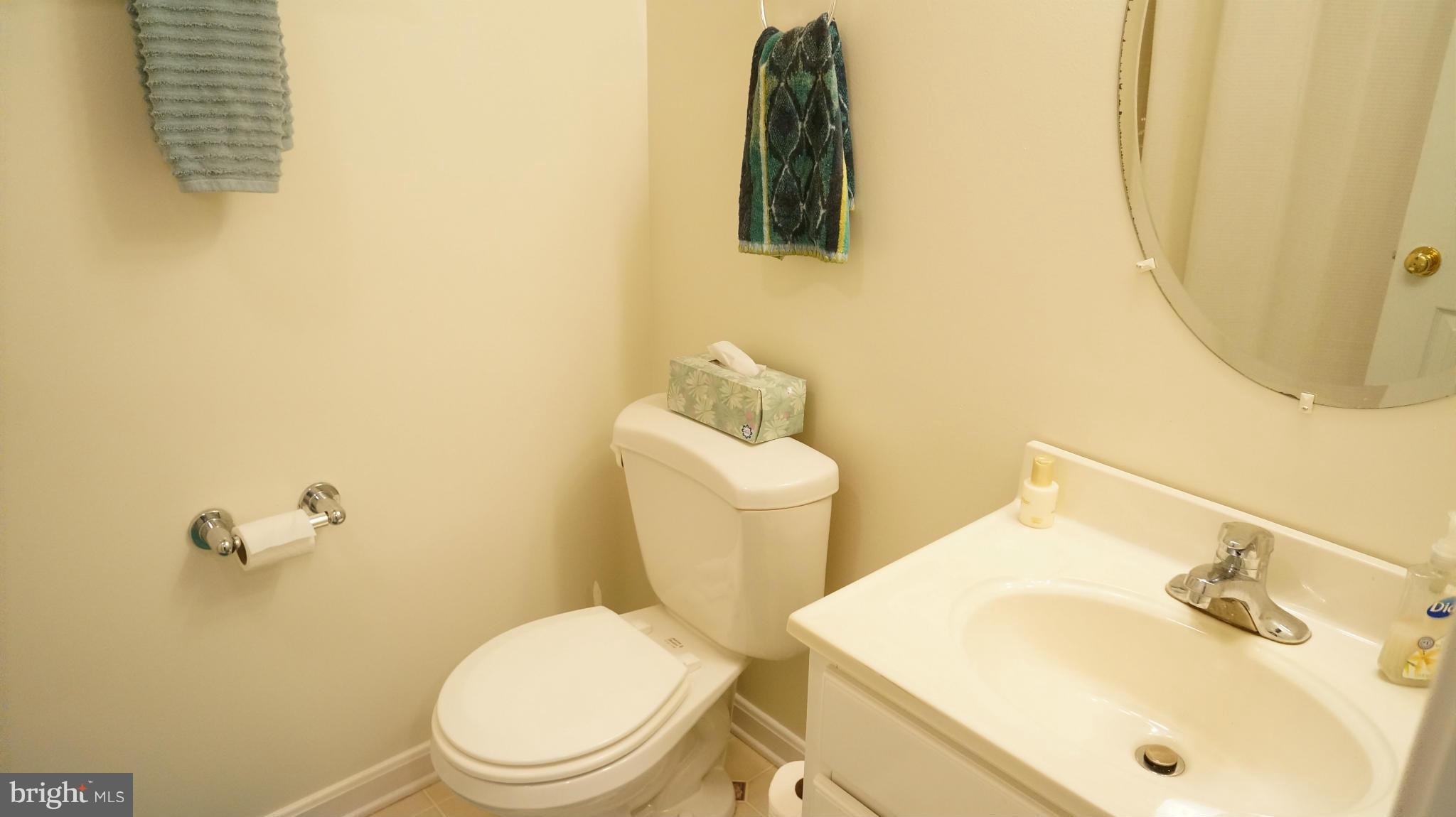 2117 Salt Kettle Way Reston, VA 20191 - Photo 14 of 30 a bathroom with a sink and mirror with toilet