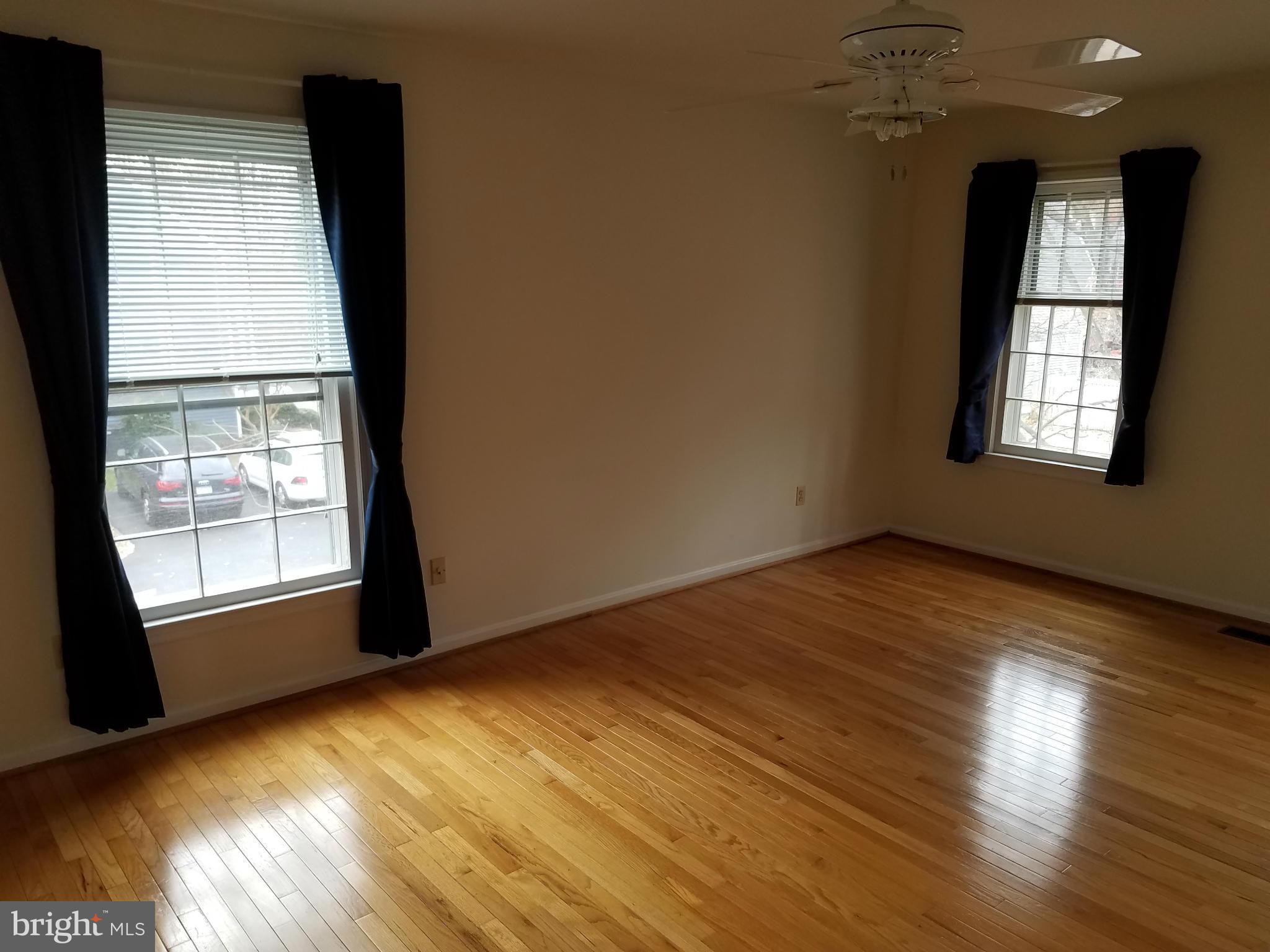 2117 Salt Kettle Way Reston, VA 20191 - Photo 16 of 30 an empty room with wooden floor and windows
