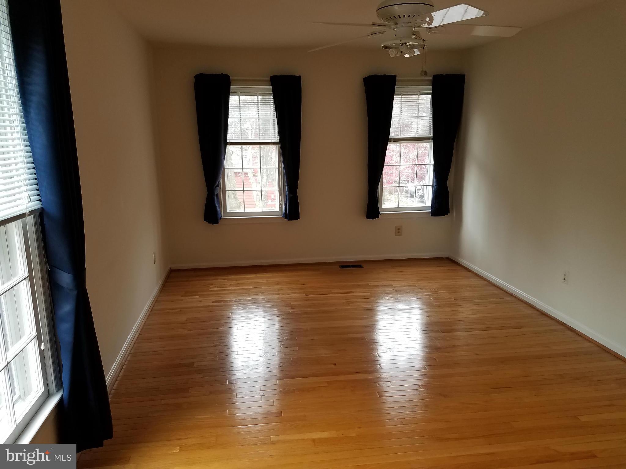 2117 Salt Kettle Way Reston, VA 20191 - Photo 19 of 30 an empty room with wooden floor and windows