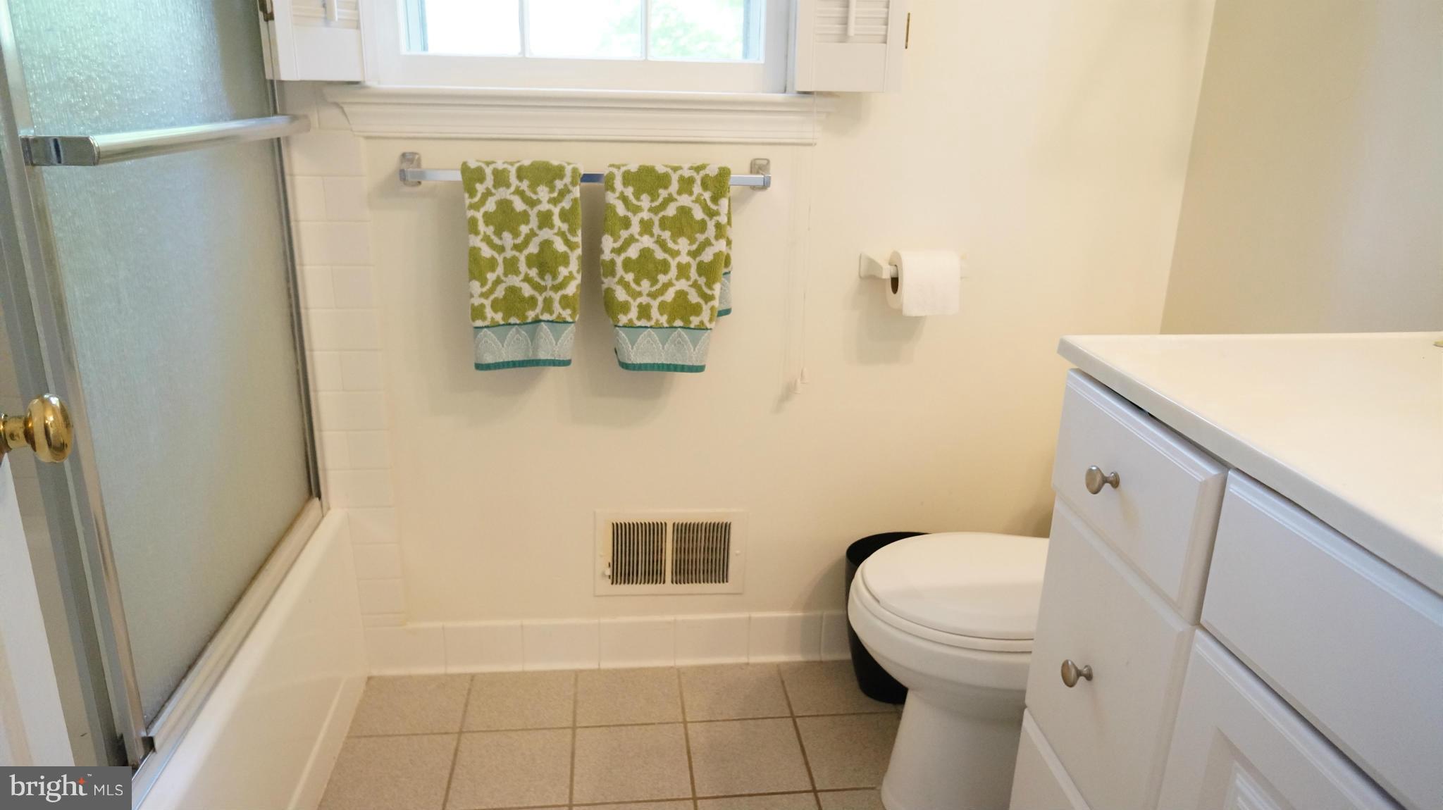 2117 Salt Kettle Way Reston, VA 20191 - Photo 21 of 30 a bathroom with a toilet and a shower curtain
