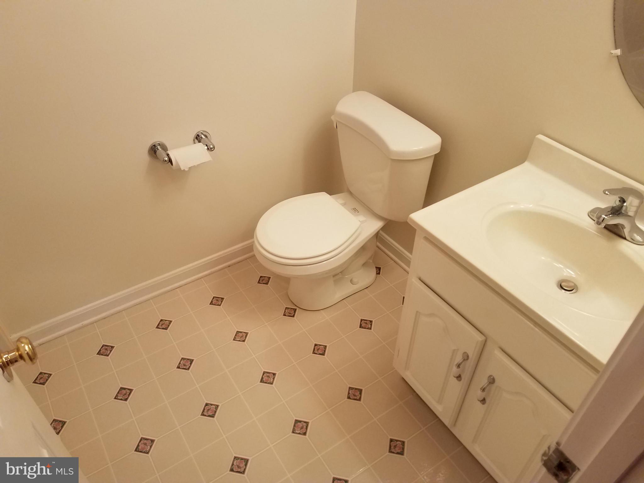 2117 Salt Kettle Way Reston, VA 20191 - Photo 26 of 30 a bathroom with a sink and a toilet