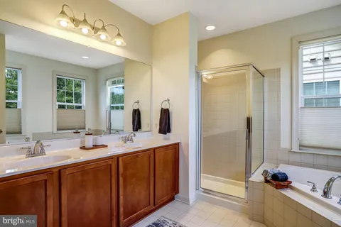 a bath tub sitting in a bathroom next to a window