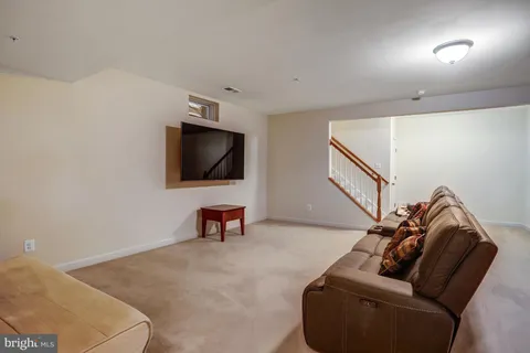 a living room with a couch and a flat screen tv