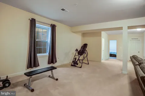 a bedroom with a bed and with potted plant