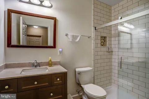 a view of a house with backyard and deck