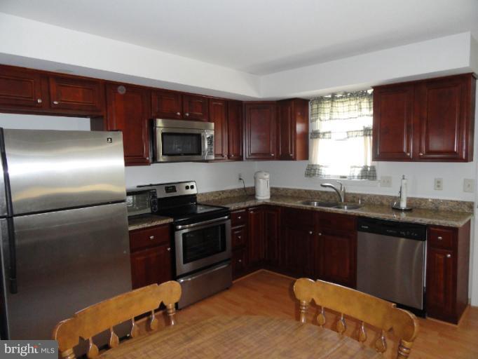 4010 Silvage Road Nottingham, MD 21236 - Photo 17 of 30 Remodeled with Granite, Cherry, Pergo