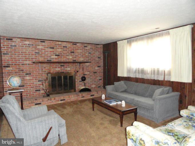 4010 Silvage Road Nottingham, MD 21236 - Photo 19 of 30 Family Room w/ Raised Hearth Fireplace
