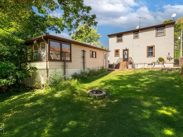 a backyard of a house with garden and patio